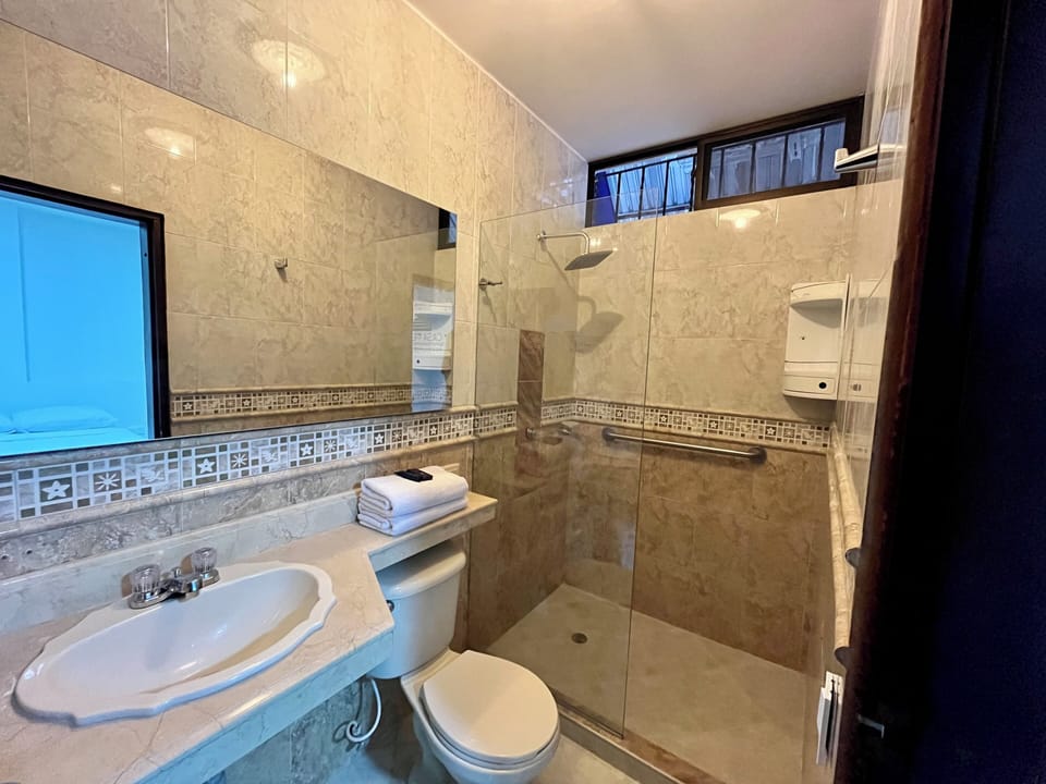 Comfort Quadruple Room | Bathroom | Shower, soap, toilet paper