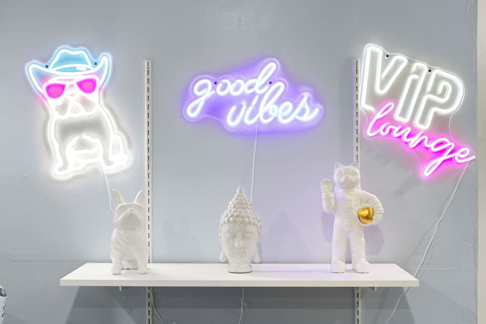Capture Instagram-worthy moments at our 'Good Vibes' neon wall – the perfect "Austin" backdrop for vacation selfies!