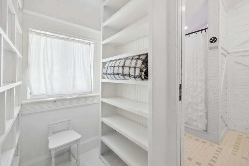 Attached to the master bedroom, walk-in closet with built-in shelves.