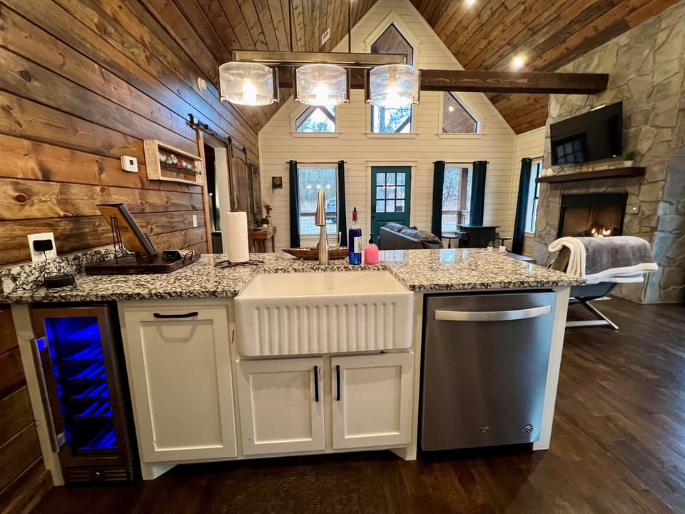Wine refrigerator and beautiful farm house sink