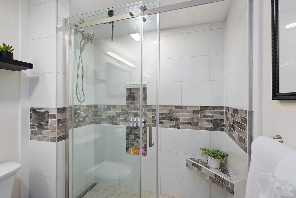 Tiled walk in shower at your primary bathroom
