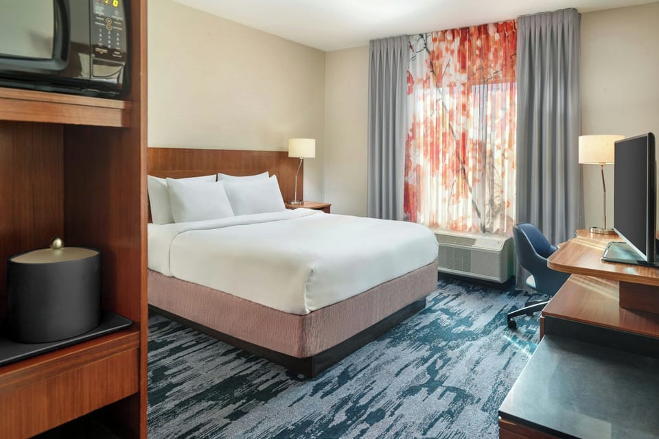 Premium bedding, desk, blackout drapes, iron/ironing board