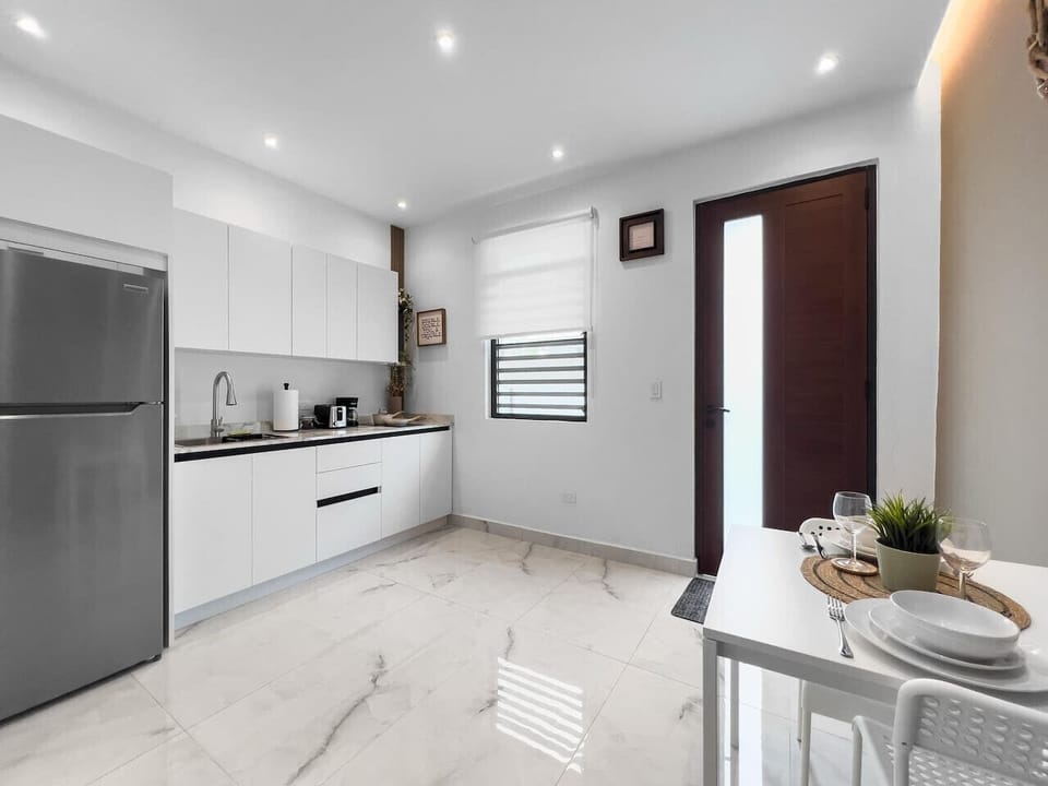 Cook with ease in a stylish kitchen where practical layout and soft lighting create a peaceful atmosphere