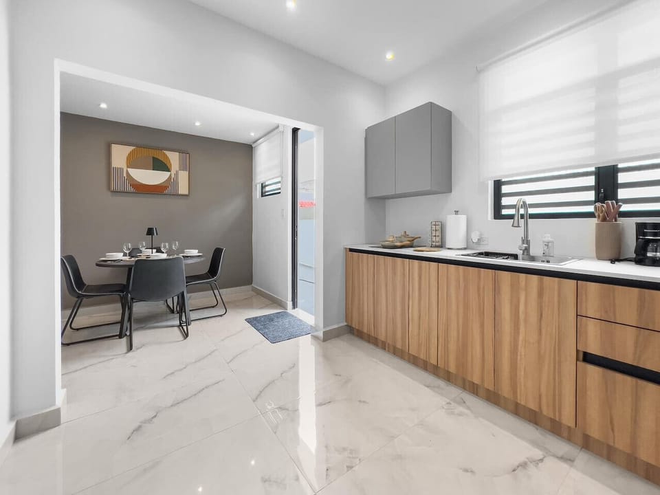 Relax in a beautifully arranged kitchen that offers warmth functionality and a calm space to enjoy your time
