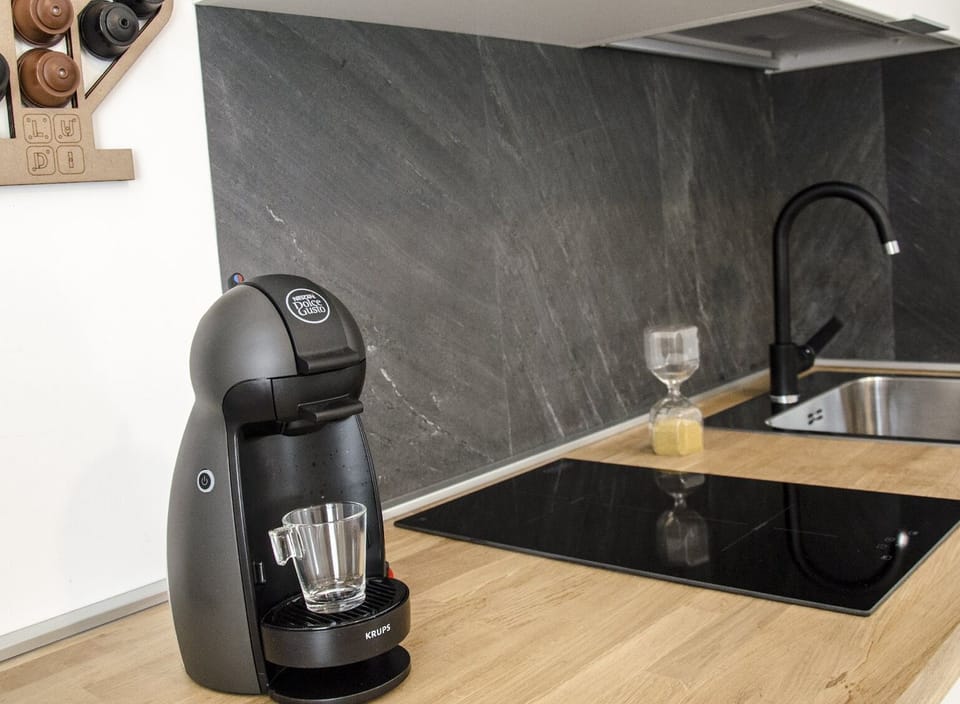 Studio, 1 Queen Bed with Sofa bed, Kitchenette | Private kitchen | Espresso maker, dining tables