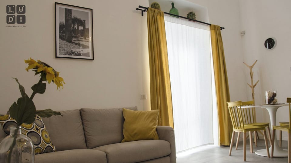 Studio, 1 Queen Bed with Sofa bed, Kitchenette | Living area | 32-inch Smart TV with digital channels