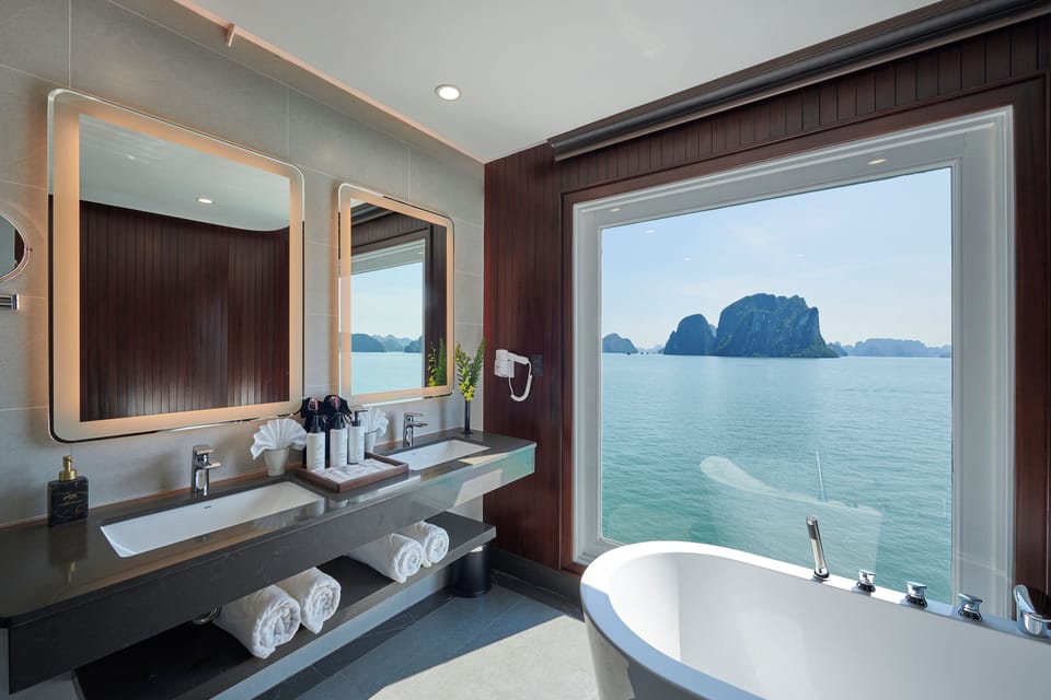 Legacy Suite Cabin | Bathroom | Hair dryer, slippers, towels, soap