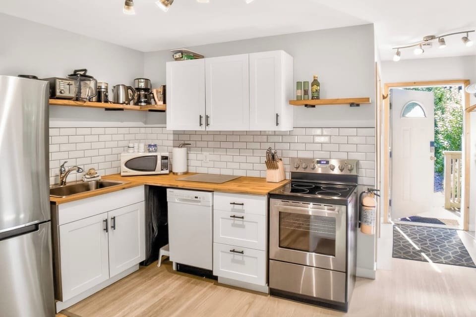 Bright, modern kitchen with everything you need to cook and dine in with ease