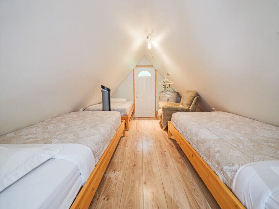 Cozy loft with 3 twin beds. Best suited for smaller humans