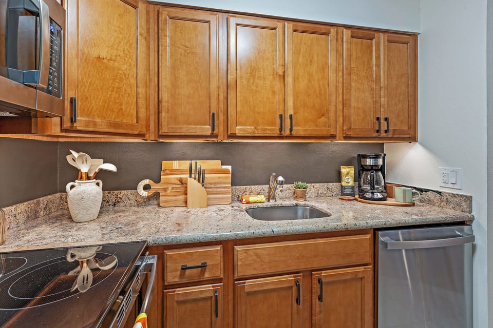 Kitchen with granite countertops and modern appliances