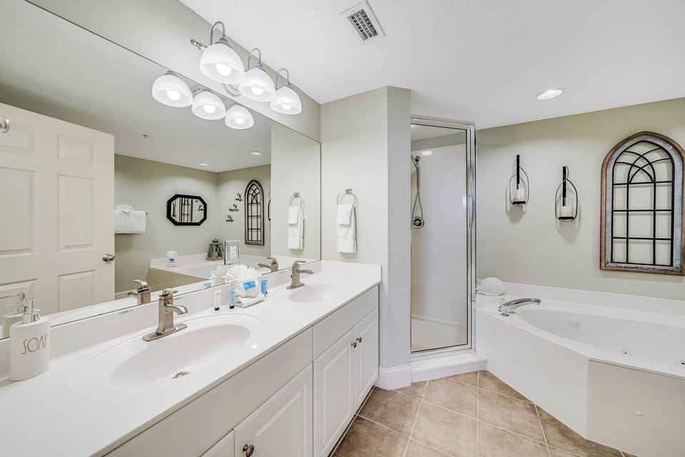 The master ensuite bathroom features a separate dressing area, spacious walk-in closet, double sinks, large soaking tub, and walk-in shower.