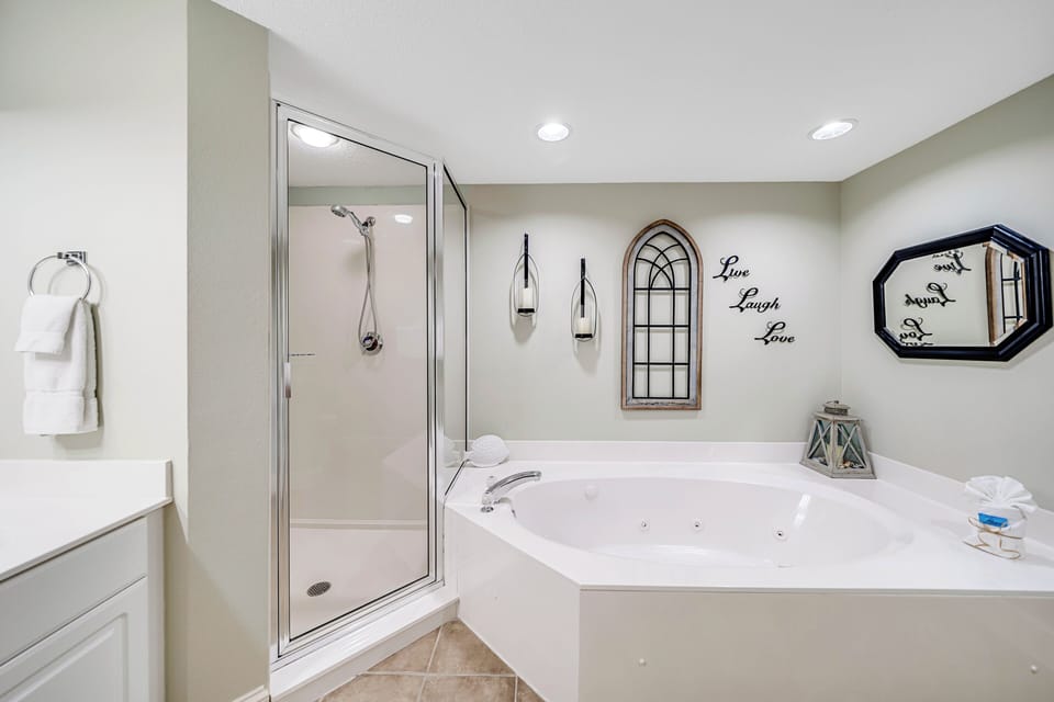 The master ensuite bathroom features a separate dressing area, spacious walk-in closet, double sinks, large soaking tub, and walk-in shower.