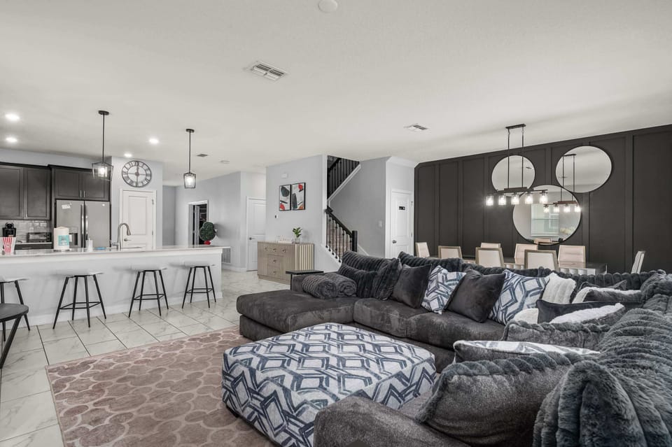 The beautiful and modern open floor plan connects the downstairs living room, dining room and kitchen, providing plenty of open space for everyone to be together!  