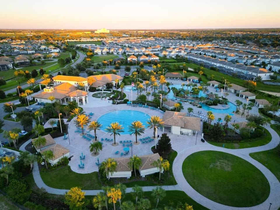 The Oasis Clubhouse, a short drive from the house, featuring pool, lazy river, slide, kids splash pad, bar & grille, movie theatre and more! Free access for all guests!