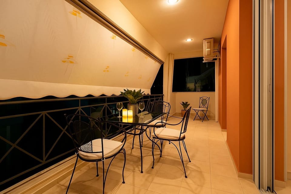 Balcony with Nighttime Drinks and Relaxing Atmosphere – The perfect setting for unwinding under the evening sky.