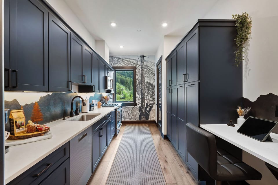 This beautifully designed kitchen perfectly blends modern elegance with practical functionality.