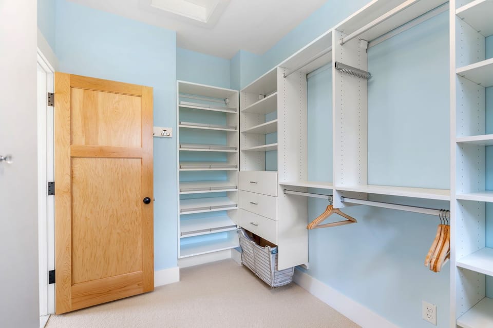 Your spacious walk-in closet offers abundant storage with custom shelving, hanging rods, and drawers to keep your wardrobe perfectly organized.