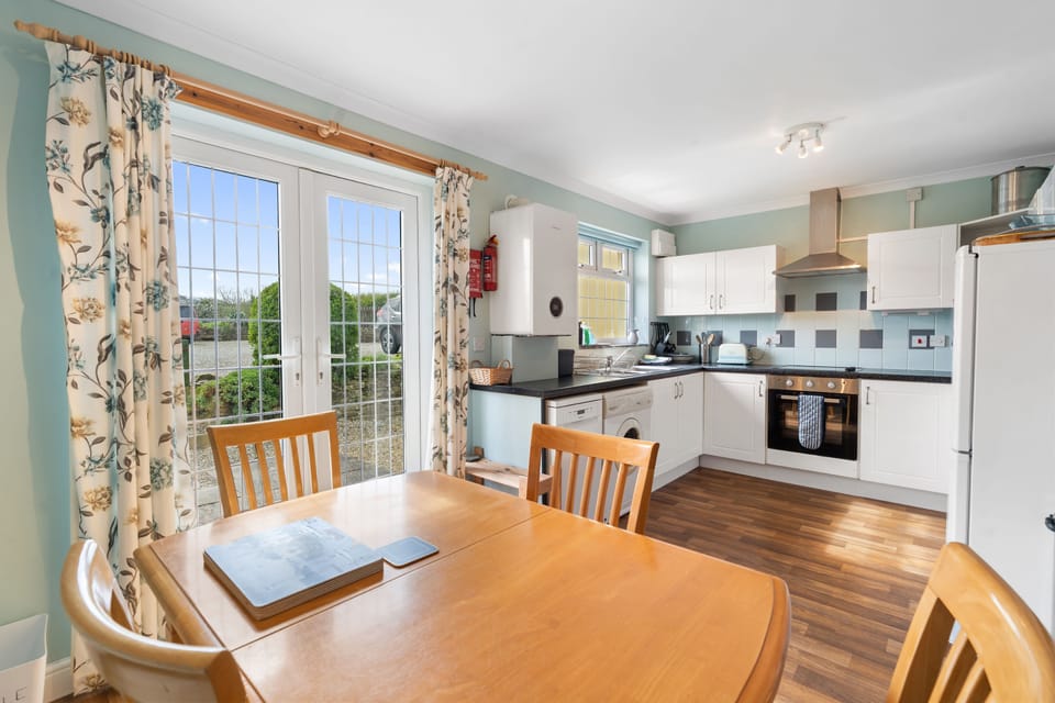Dining Table and chairs in Kitchen at Kegyn Holiday Home Harlyn Bay, Padstow
