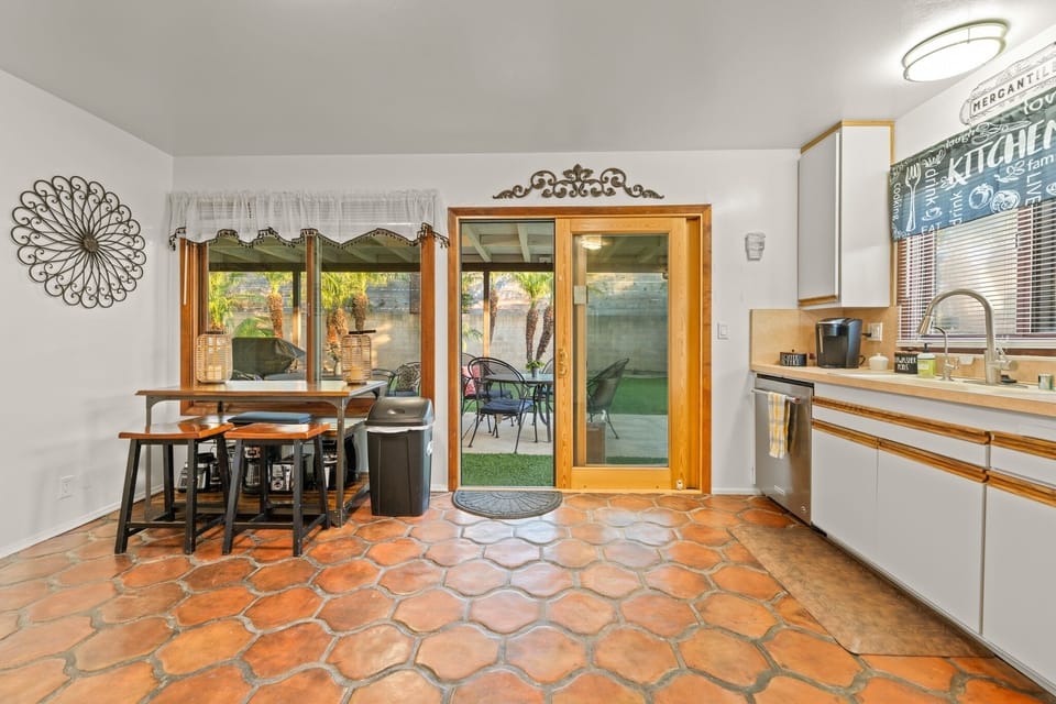 The kitchen features seating for four with direct access/views of the backyard.  