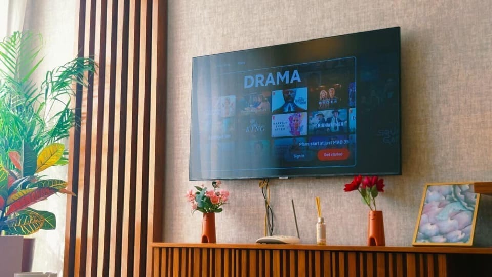 Deluxe Condo | Living area | 40-inch Smart TV with satellite channels, Netflix, pay movies