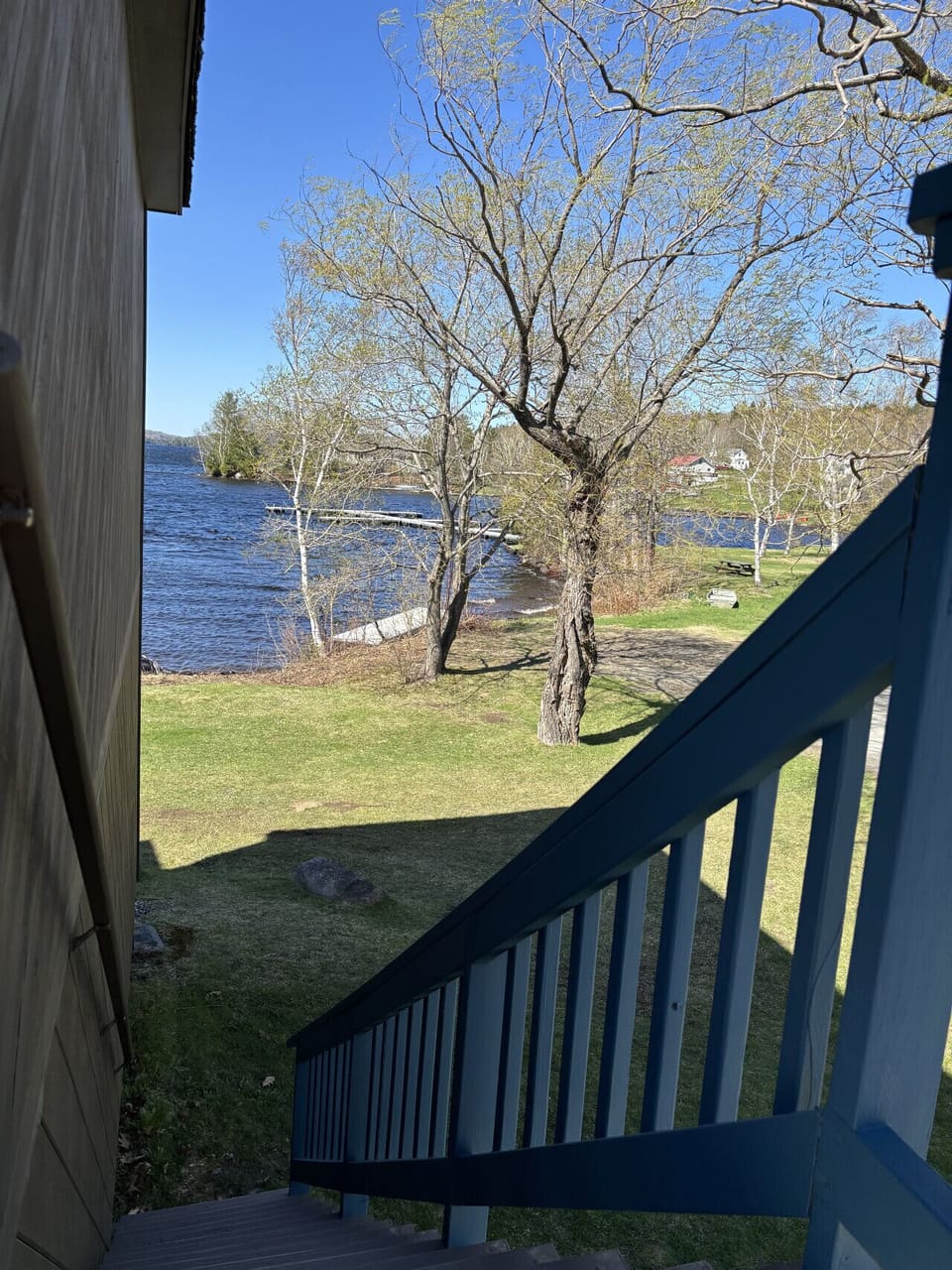 Scenic waterfront property with direct access to the lake, private docks, and beautiful grounds perfect for relaxing by the water.