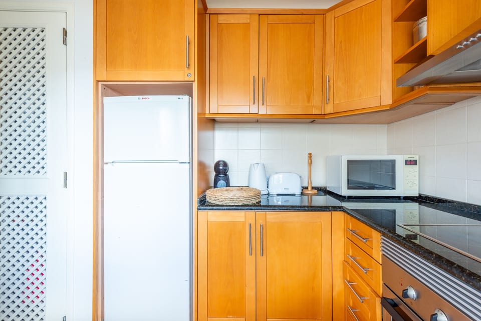 Apartment, 2 Bedrooms, Pool Access | Private kitchen | Microwave, dishwasher, coffee/tea maker, cookware/dishes/utensils