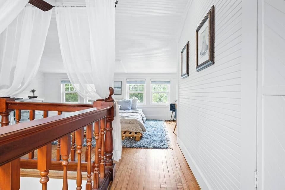 Welcoming entry leading into a cozy bedroom retreat upstairs