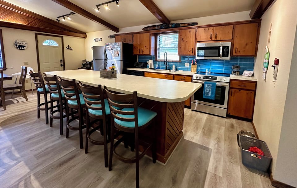 Kitchen with large eat in bar