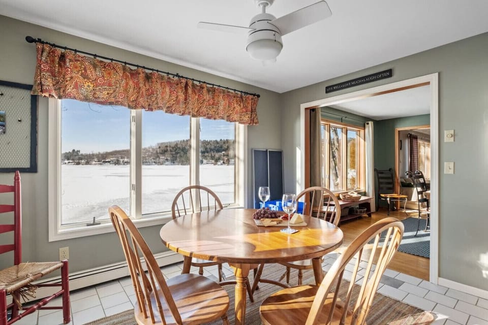 Lakeside dining area offering natural light, charm, and unforgettable views.