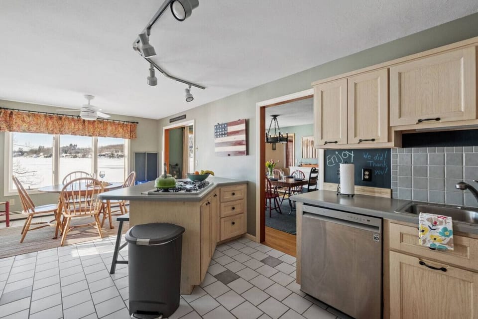 Bright kitchen and dining area featuring modern appliances and room for everyone.