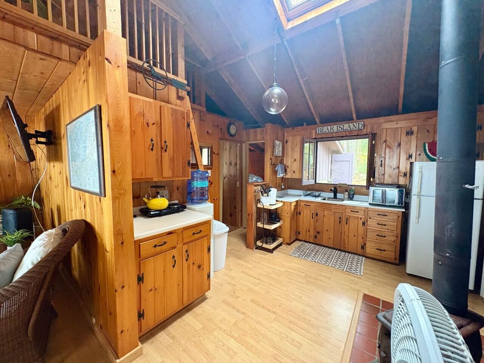 Prepare meals in a warm, rustic kitchen space