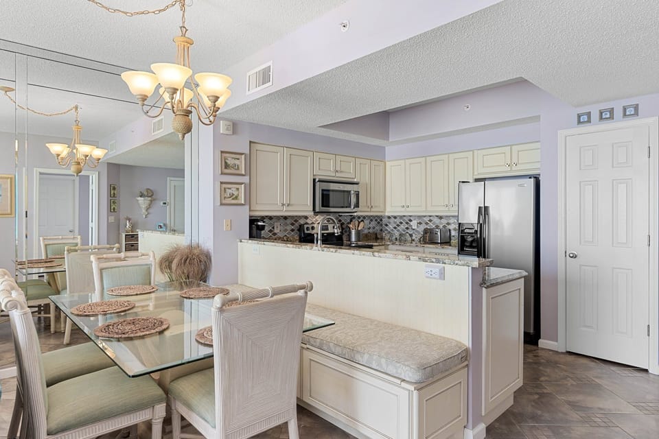 Kitchen bar seating offers a casual spot for coffee, snacks & conversation.