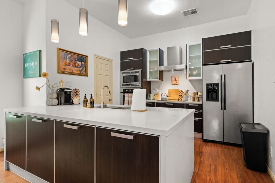 A sleek kitchen featuring a modern kitchen island