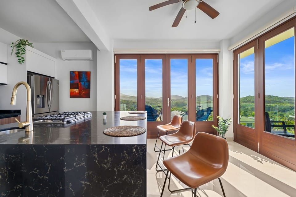 Stylish kitchen with natural light and views.