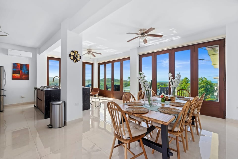 Bright dining space with scenic windows.
