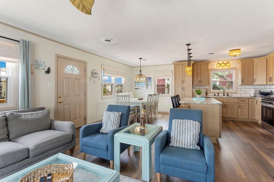 The Main Level features a spacious Living Area, perfect for unwinding after a day of seaside exploration.