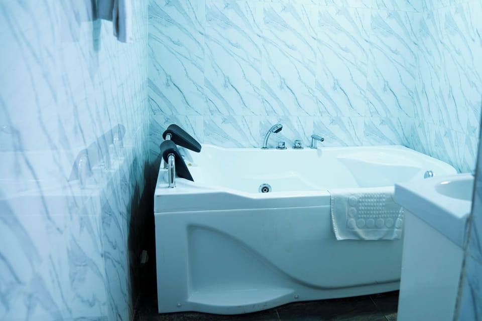 Suite, Balcony, City View | Bathroom | Free toiletries, hair dryer, slippers, towels