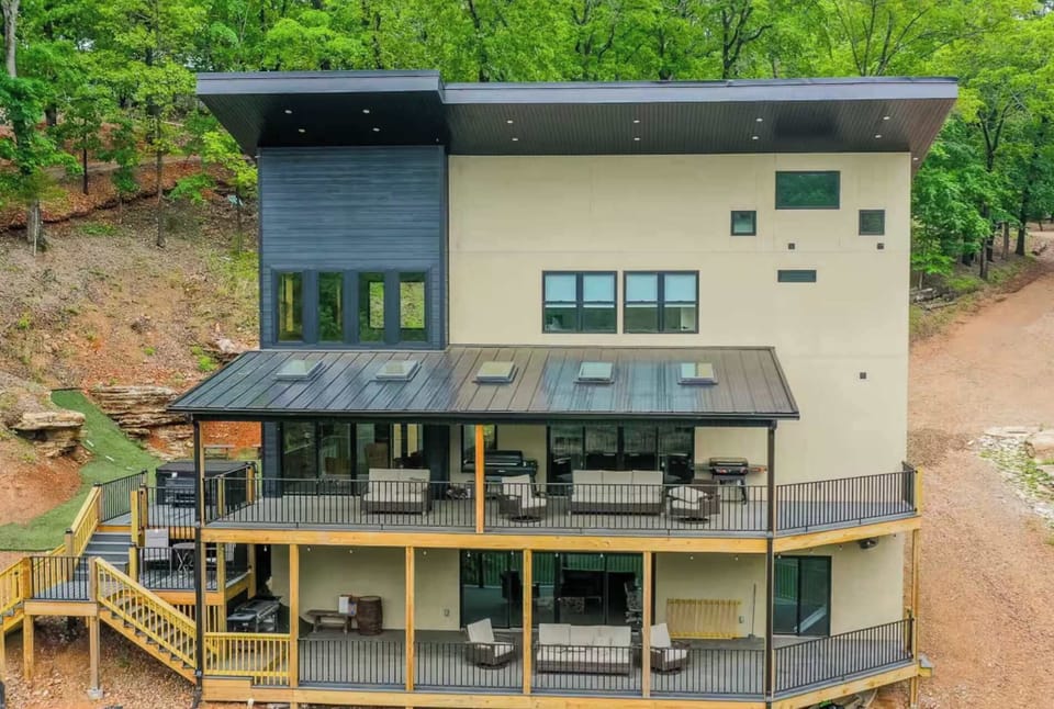 A modern sanctuary nestled amidst the verdant embrace of the lakeside landscape. Architectural brilliance meets tranquil escape.