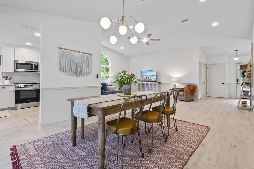 Open concept dining room with views of the patio and pool—perfect for enjoying meals with a relaxing, scenic backdrop.