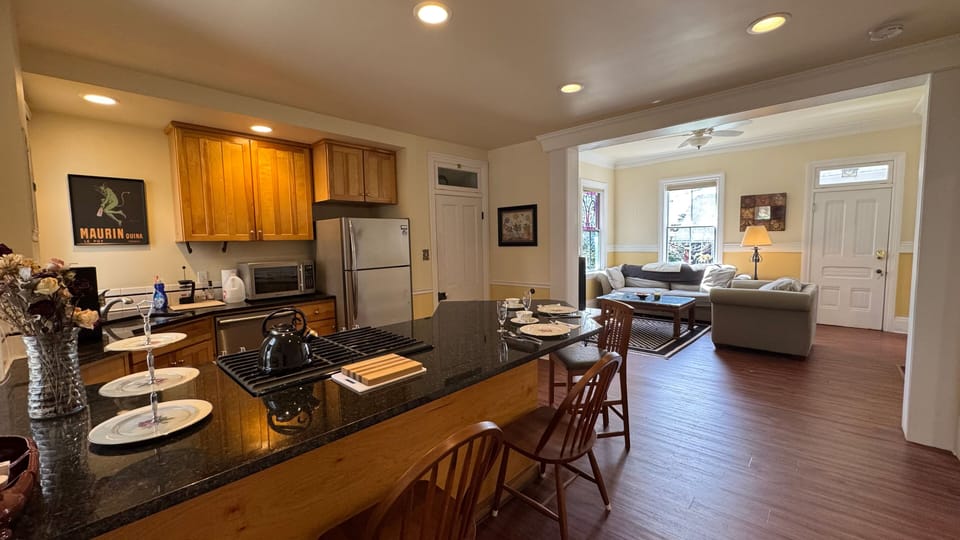kitchen, with eating counter and view of living room