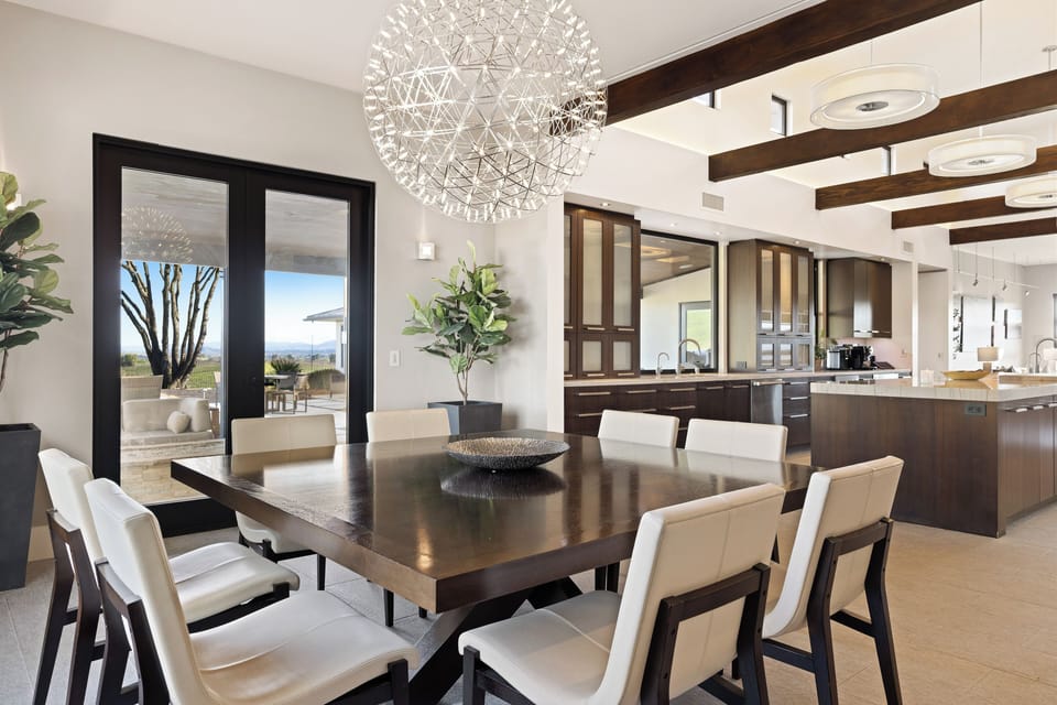 Stylish modern décor complemented by elegant, statement lighting for a sophisticated ambiance.