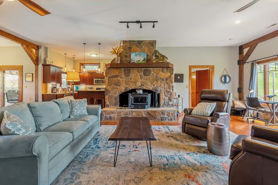 Warm open-plan living anchored by a stunning stone hearth.
Has a queen pull out couch, also a futon twin sleeper chair
(Linens are in bedrom 1 closet)