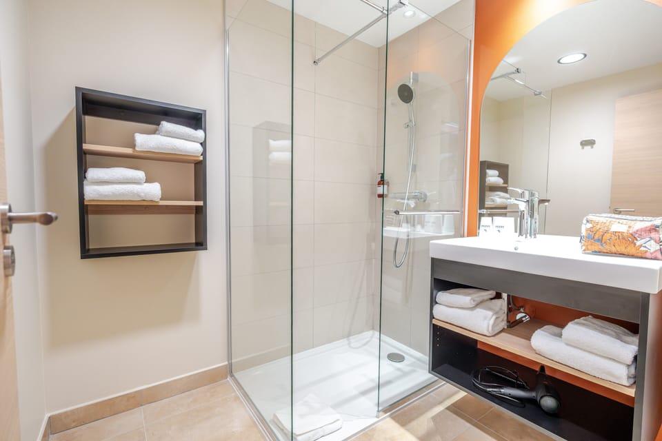 Shower, eco-friendly toiletries, hair dryer, towels