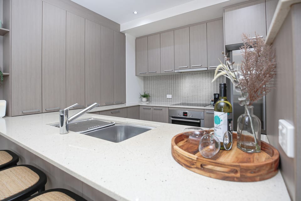 Deluxe Apartment, Balcony, Pool View | Private kitchen | Full-size fridge, microwave, oven, stovetop