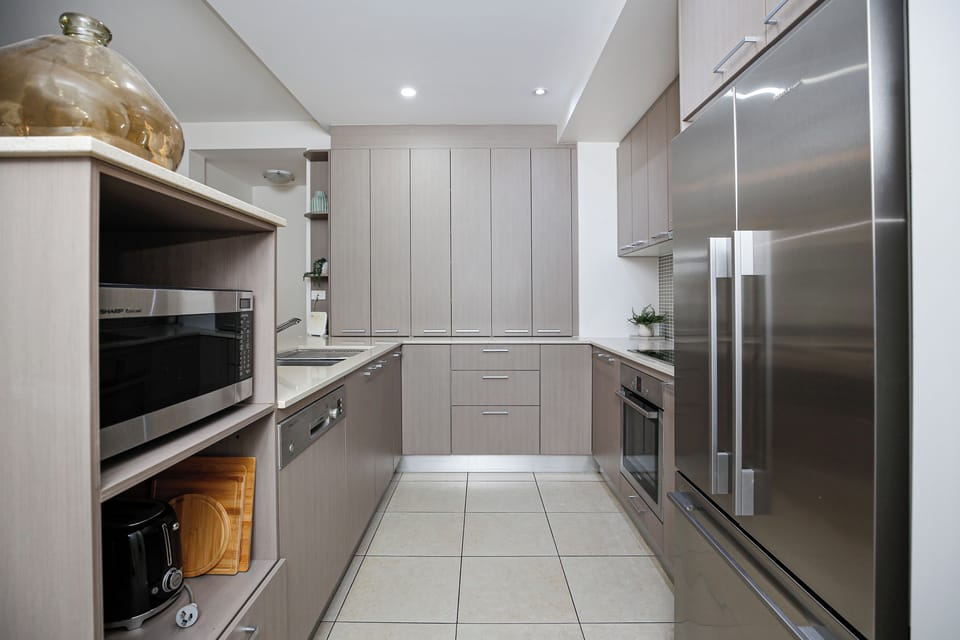 Deluxe Apartment, Balcony, Pool View | Private kitchen | Full-size fridge, microwave, oven, stovetop