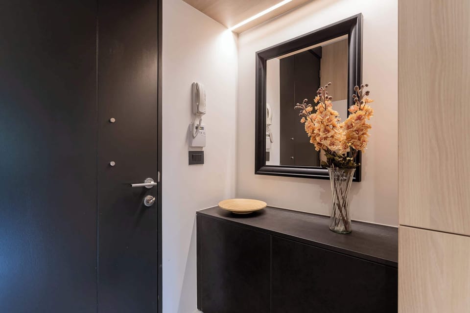 Welcome to a stylish entryway featuring modern decor and a touch of elegance to start your stay.