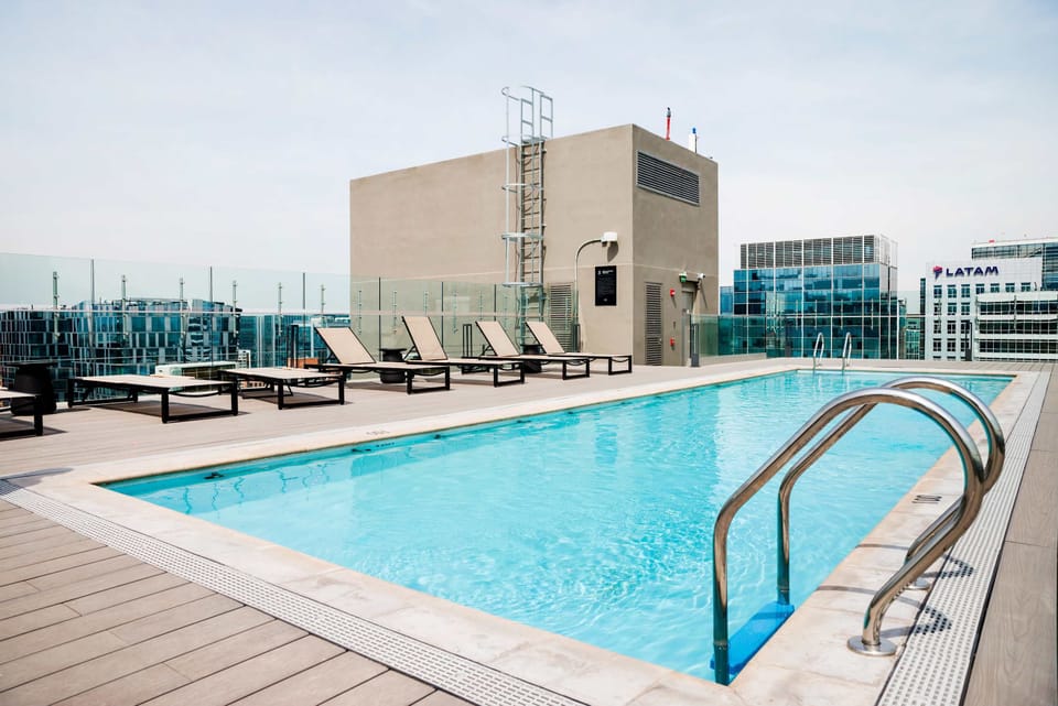 Enjoy a refreshing swim in the rooftop pool with stunning city views.