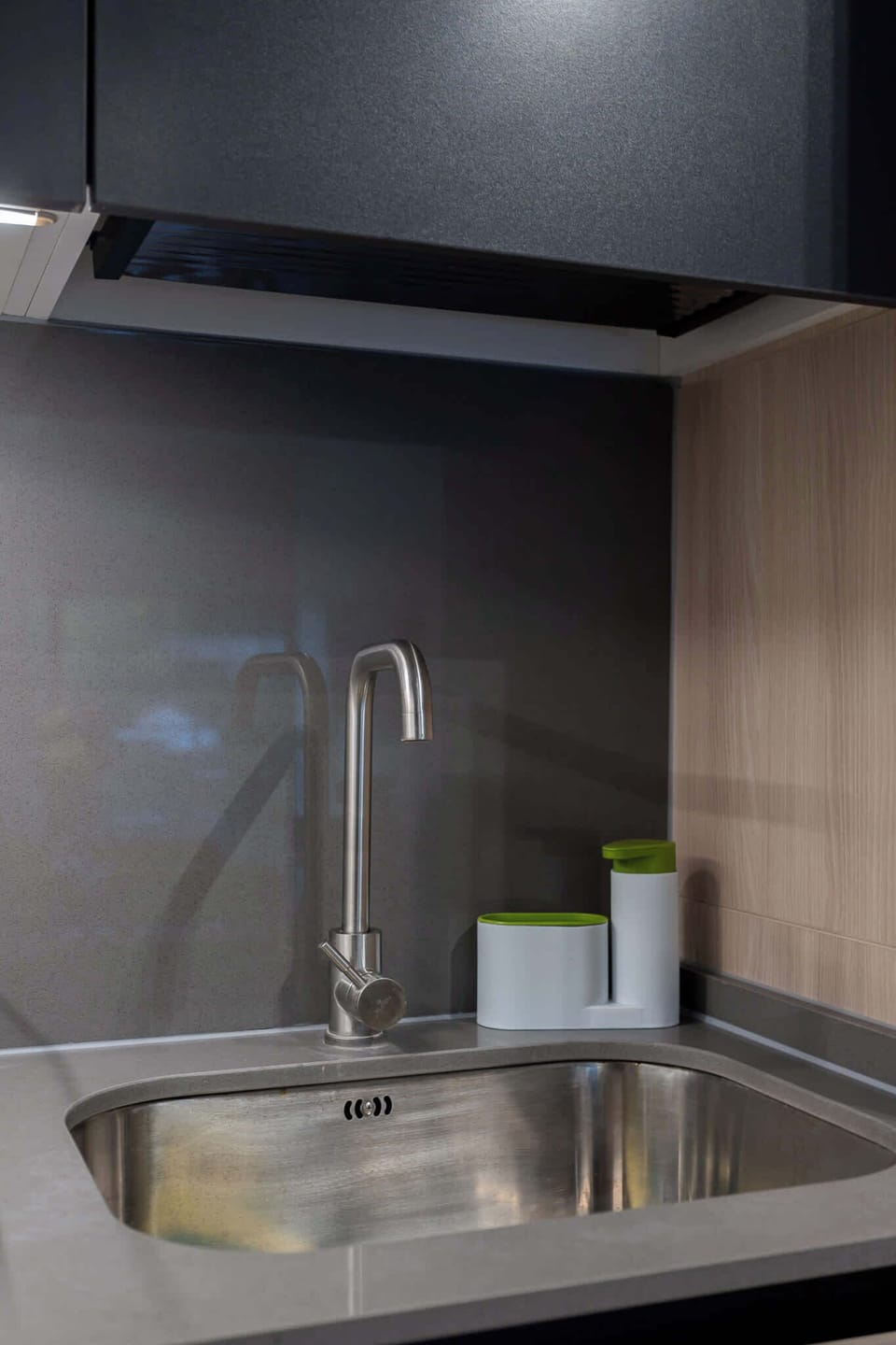 Modern kitchen with sleek design and stainless steel accents, perfect for preparing meals during your stay.