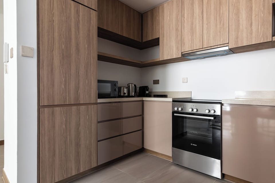 Luxury Apartment, 2 Bedrooms, Partial Sea View | Private kitchen | Full-size fridge, microwave, oven, stovetop