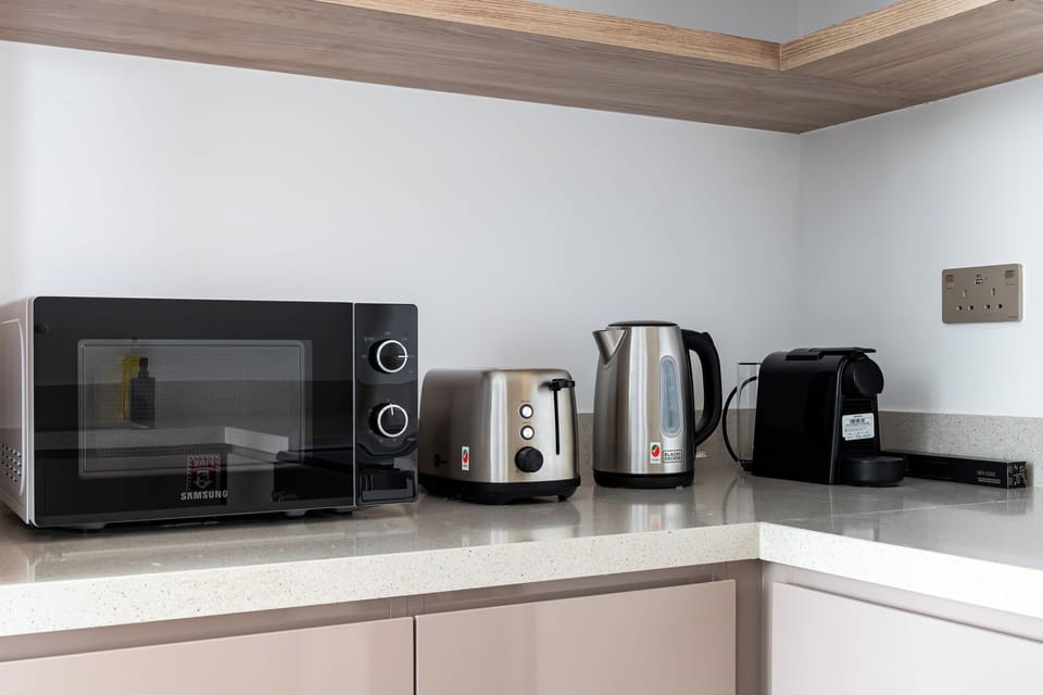 Luxury Apartment, 2 Bedrooms, Partial Sea View | Private kitchen | Full-size fridge, microwave, oven, stovetop